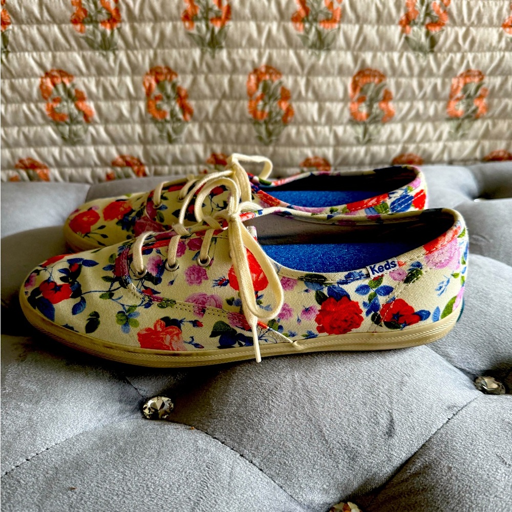 Women’s white Keds with red & colored flowers.